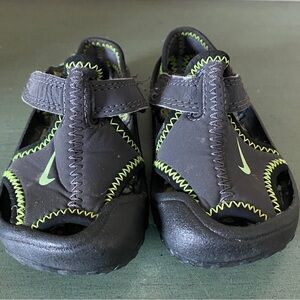 Nike sandals. Velcro closure. Infant/toddler. Lug sole. Black/ neon.